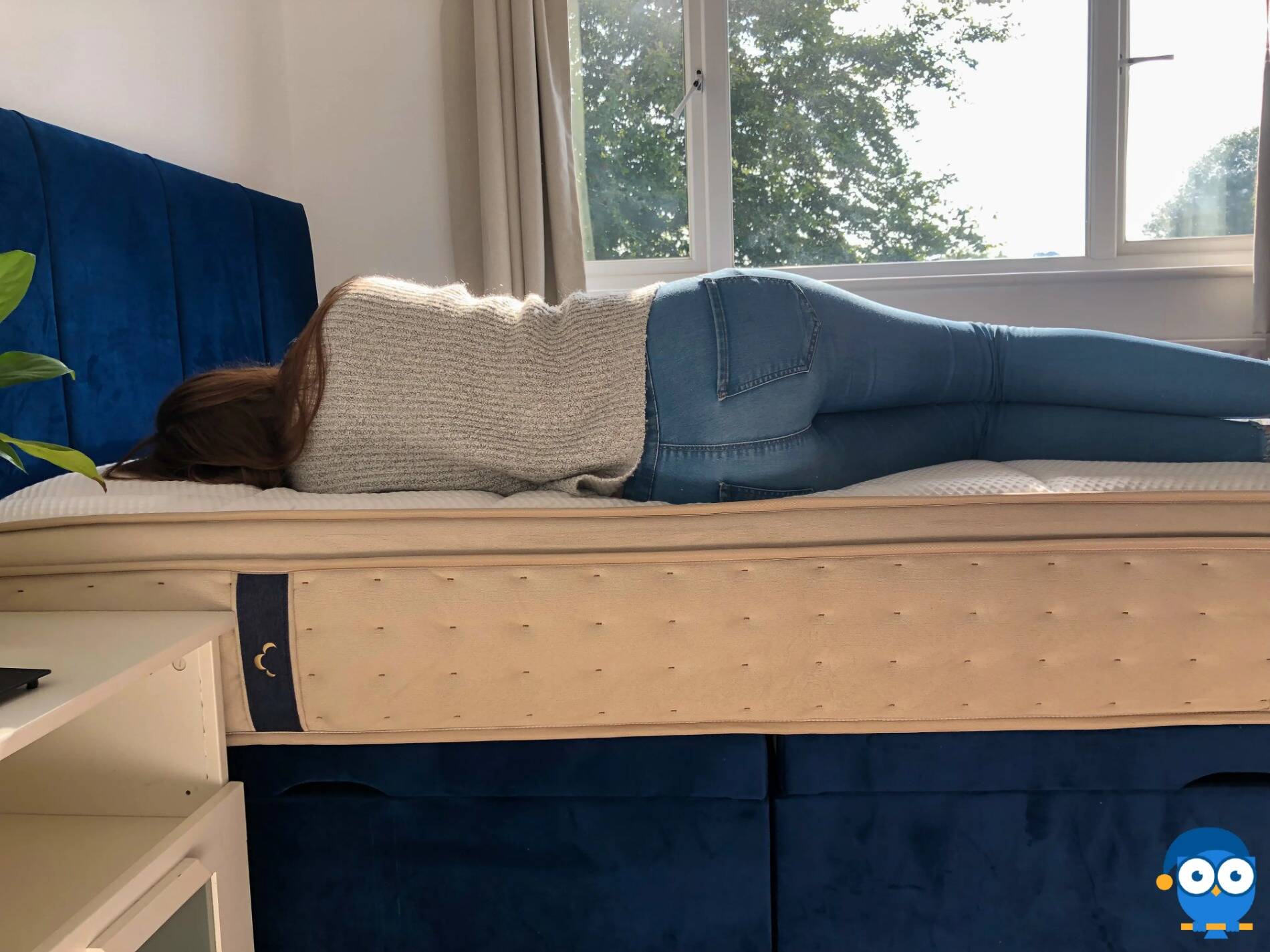 Person laying on side on DreamCloud mattress. 